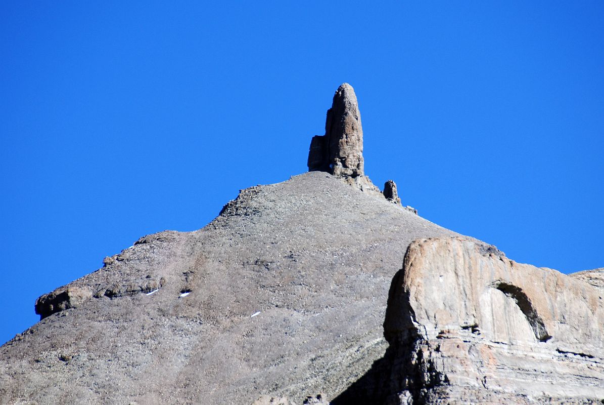 08 Lingam Shaped Rock On Western Wall Of Kailash On Mount Kailash Inner Kora Nandi Parikrama After cresting the ridge above the confluence of the two dry rivers, a lingam-shaped rock protrudes from the west wall of the Mount Kailash Inner Kora (08:28).